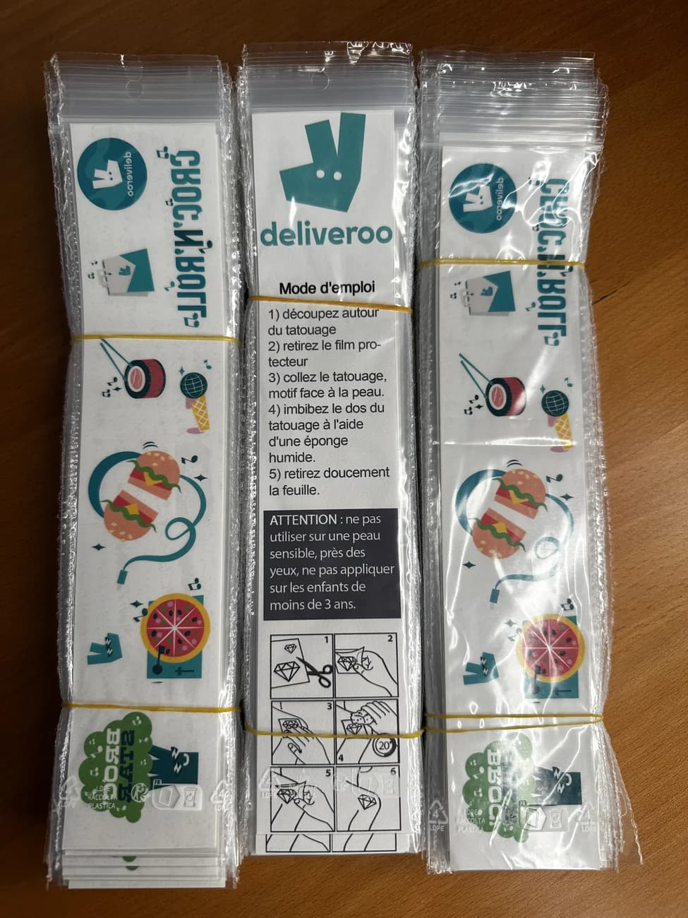 Deliveroo branded temporary tattoo sheets bundled for dispatch