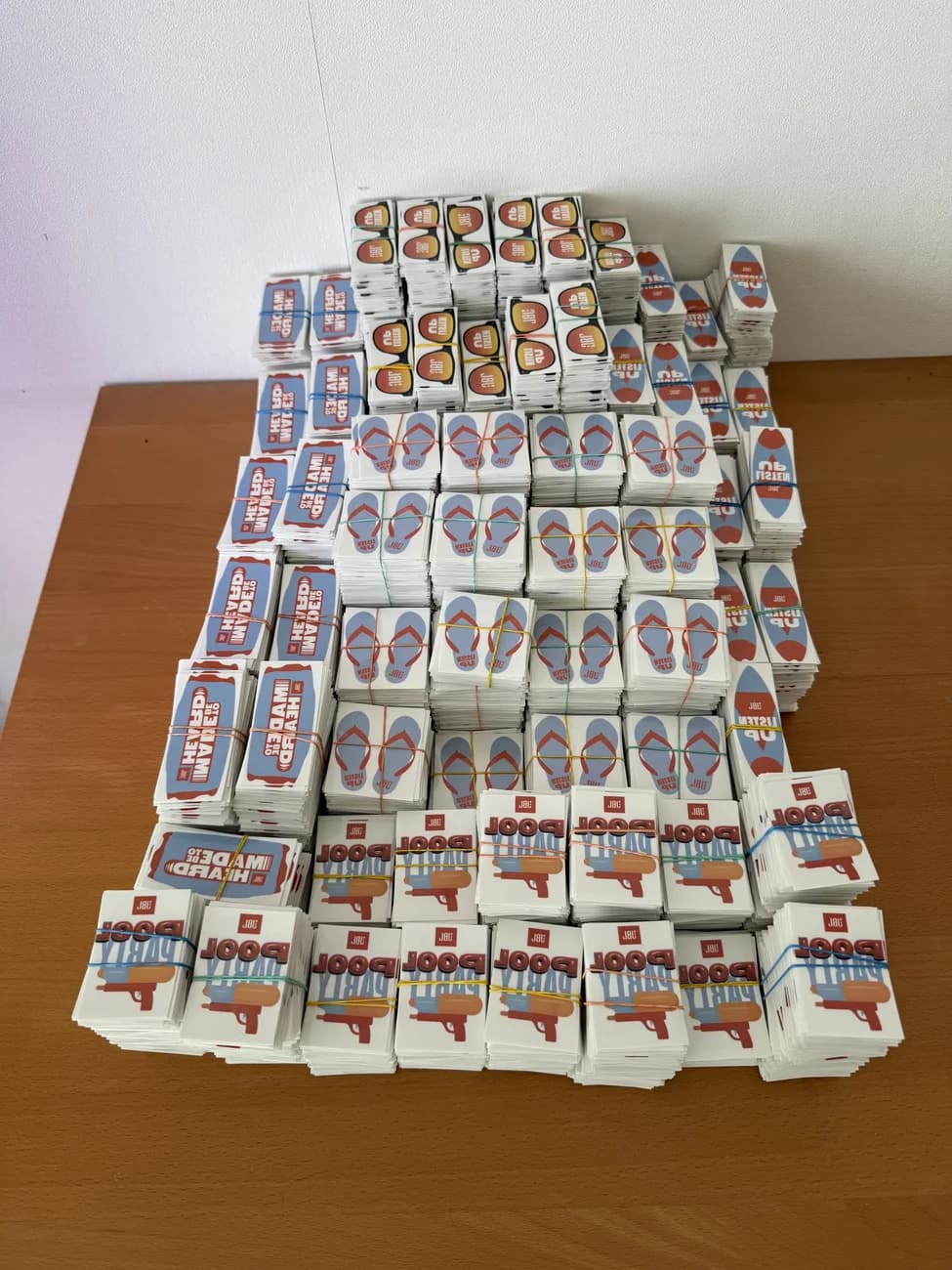 JBL branded temporary tattoo sheets stacked in bulk