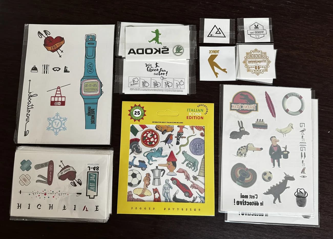 Assortment of branded temporary tattoo sheets for different clients