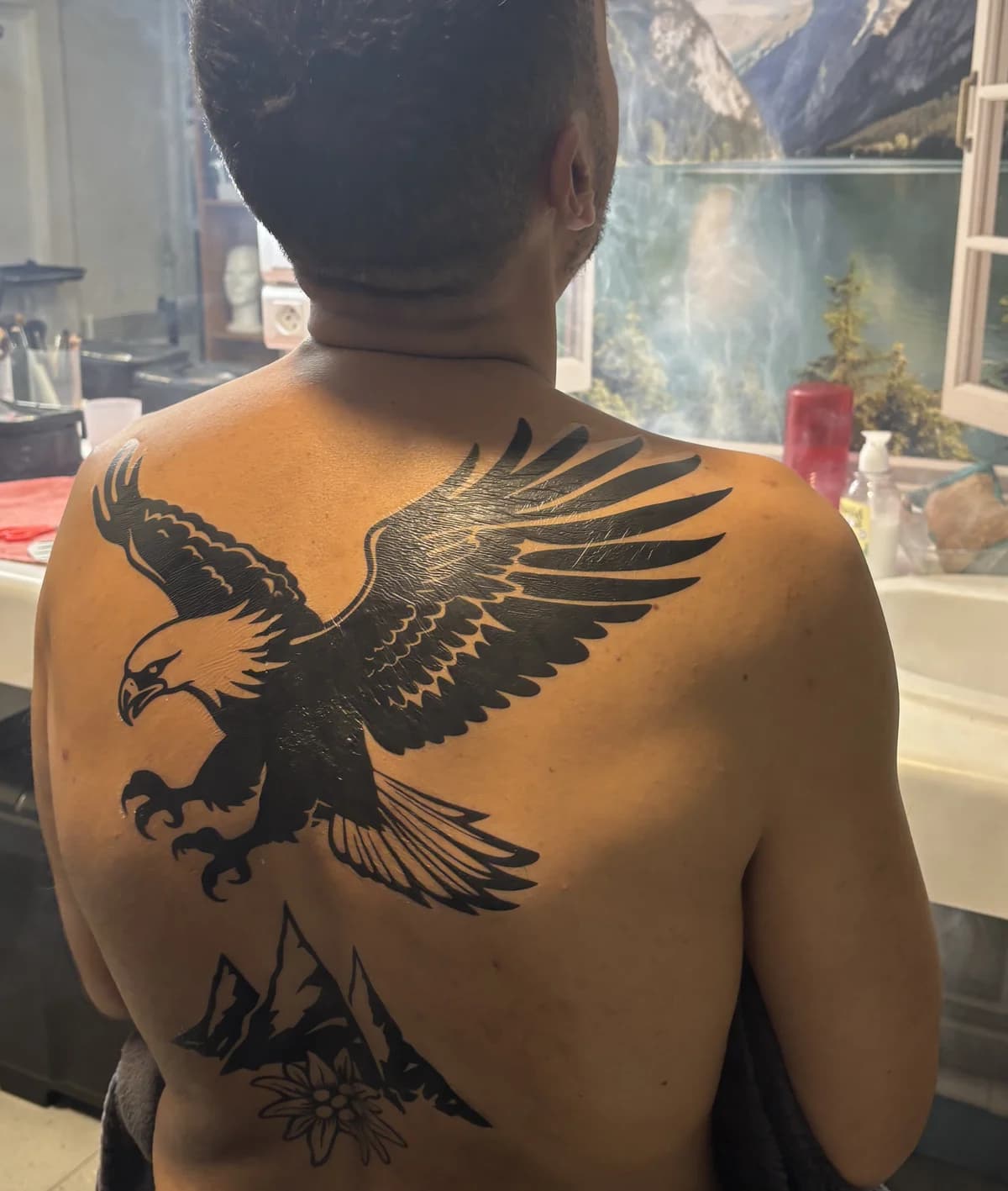 Spread-winged eagle back piece in bold black ink