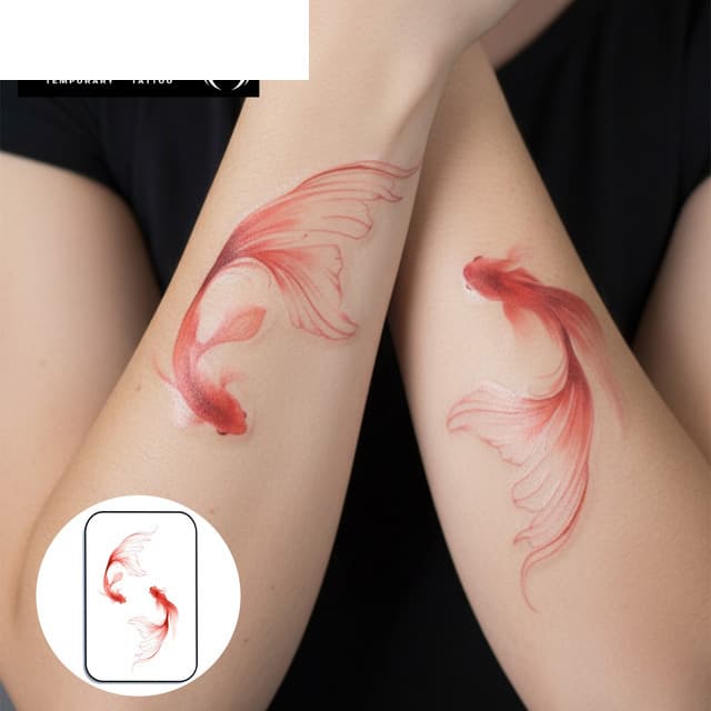 Twin red veiltail goldfish